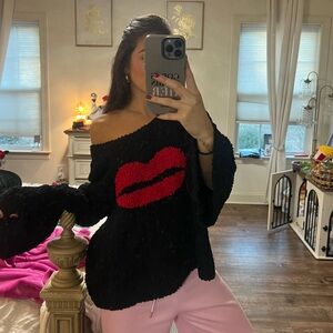Chic Off-Shoulder Black Sweater with Red Lips